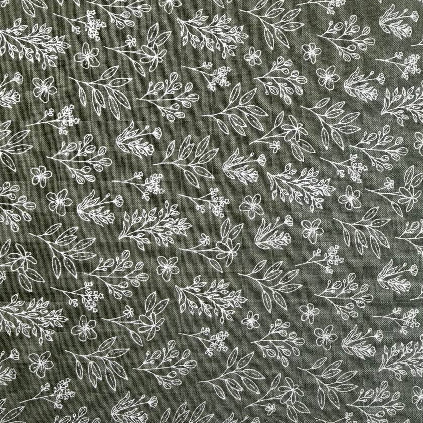 Green cotton fabric with small white botanical floral print, soft quilting cotton texture