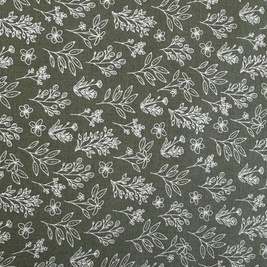 Green cotton fabric with small white botanical floral print, soft quilting cotton texture