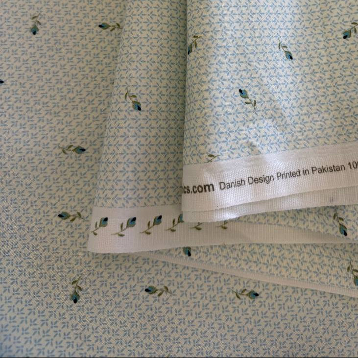 Light blue cotton fabric with small delicate floral print by Stof, soft quilting fabric