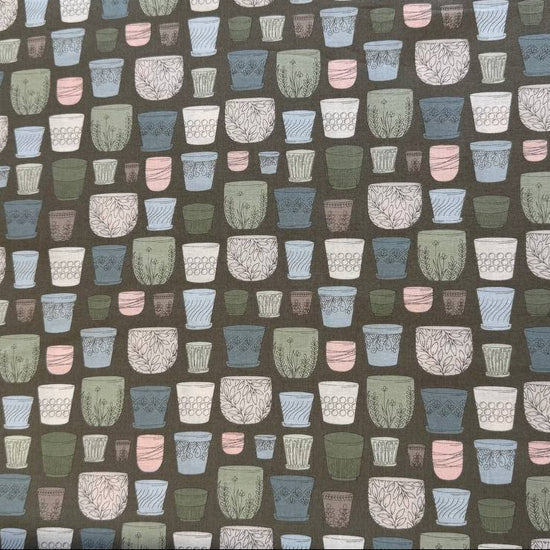 Cotton fabric with potted plants print in pastel colors on olive green background by Moda