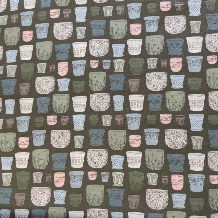 Cotton fabric with potted plants print in pastel colors on olive green background by Moda
