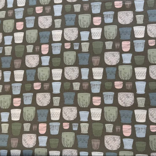 Cotton fabric with potted plants print in pastel colors on olive green background by Moda