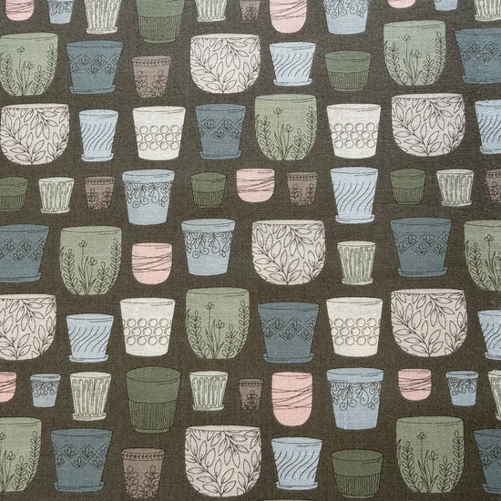 Cotton fabric with potted plants print in pastel colors on olive green background by Moda