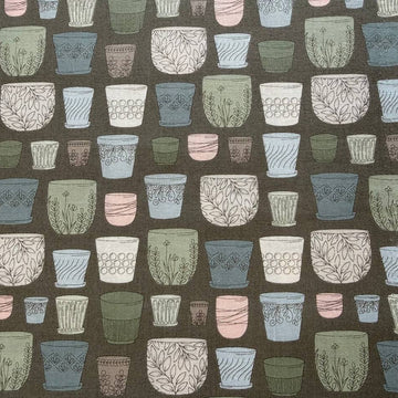 Cotton fabric with potted plants print in pastel colors on olive green background by Moda