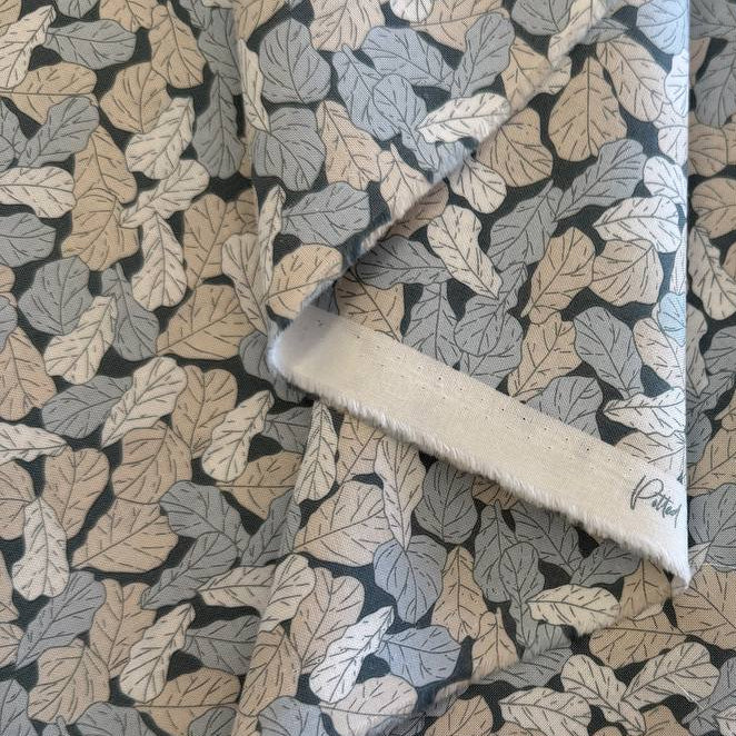Cotton fabric with leaf print in sage green, beige and blue tones from Moda Potted collection