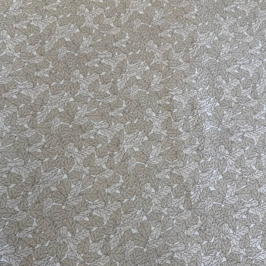 Cream cotton fabric with delicate leaf print pattern