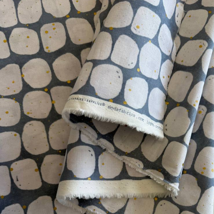 Blue and white pebble print cotton fabric with gold speckles by Zen Chic Flirtation collection