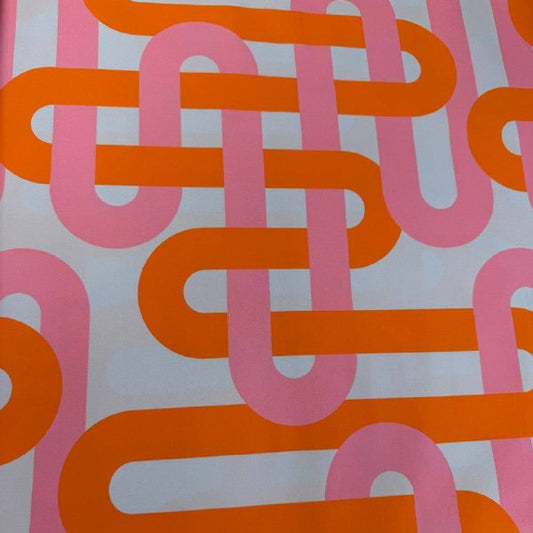 Retro geometric cotton fabric with bold pink and orange interlocking lines on a light blue background from Groove by Emily Van Hoff for Moda.