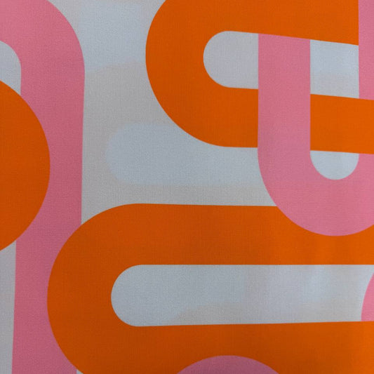 Retro geometric cotton fabric with bold pink and orange interlocking lines on a light blue background from Groove by Emily Van Hoff for Moda.