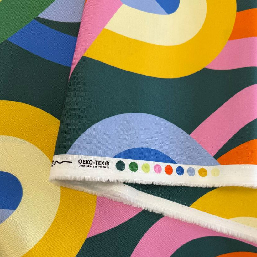 Abstract colorful geometric cotton fabric Groove Moody Multi by Emily Van Hoff for Moda with green blue orange and pink shapes