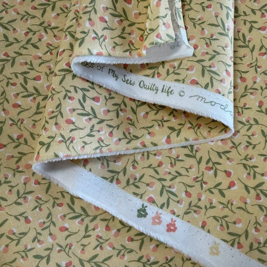 Yellow floral cotton fabric with small pink flowers and green vines, Flower Girl collection by My Sew Quilty Life for Moda.