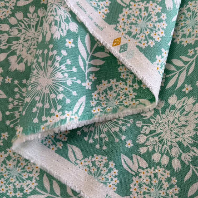 Moda Tango by Kate Spain Sea 527332-23 green cotton fabric with white floral burst print