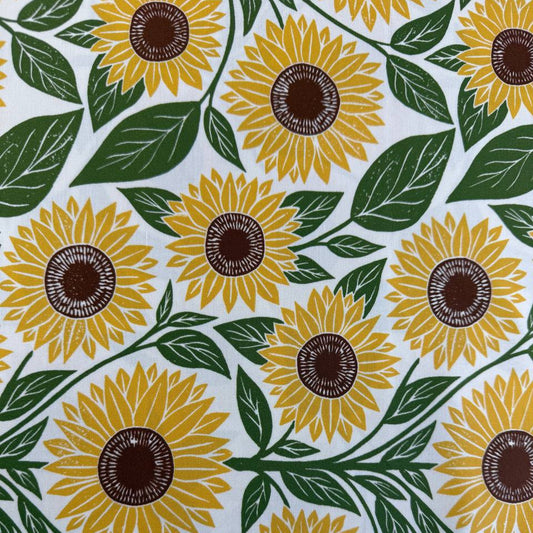Sunflower cotton fabric by Katharine Watson for Moda, Garden Series, cream background with yellow sunflowers and green leaves