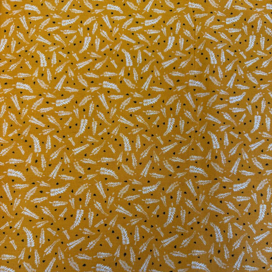 Mustard cotton fabric with white fern leaf print quilting cotton