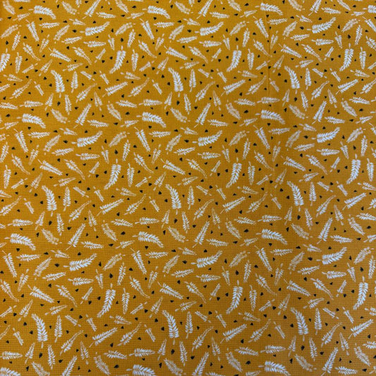 Mustard cotton fabric with white fern leaf print quilting cotton