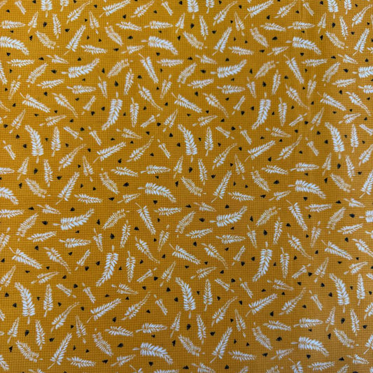 Mustard cotton fabric with white fern leaf print quilting cotton