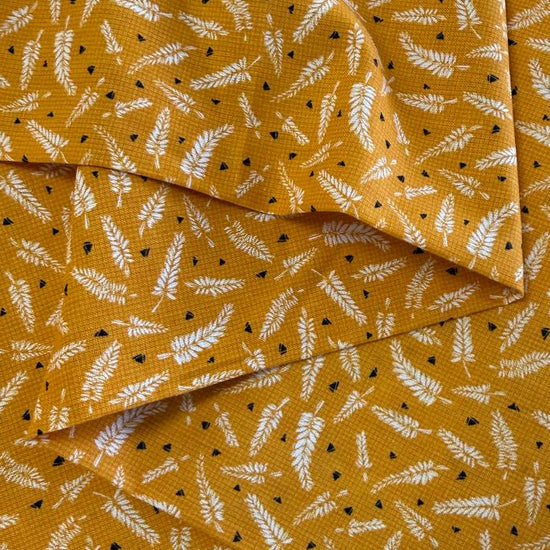 Mustard cotton fabric with white fern leaf print quilting cotton