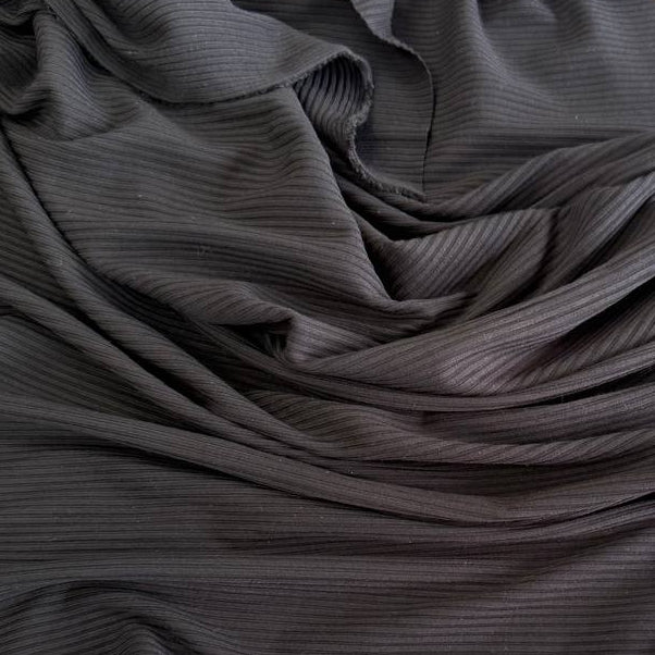 Soft bamboo rib knit fabric with fine vertical ribs, excellent stretch, and a smooth texture, available in multiple colours.