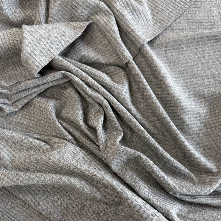 Soft bamboo rib knit fabric with fine vertical ribs, excellent stretch, and a smooth texture, available in multiple colours.