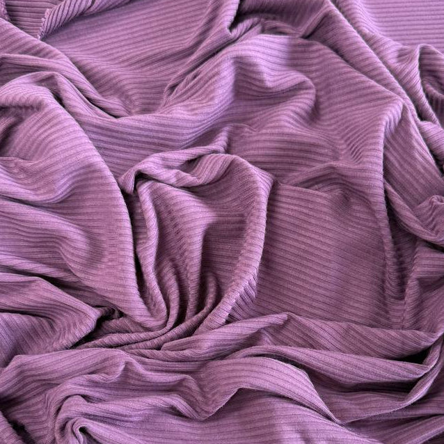 Soft bamboo rib knit fabric with fine vertical ribs, excellent stretch, and a smooth texture, available in multiple colours.