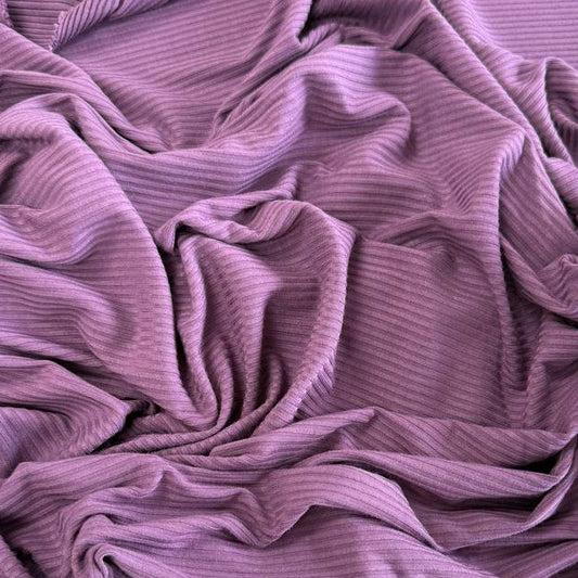 Soft bamboo rib knit fabric with fine vertical ribs, excellent stretch, and a smooth texture, available in multiple colours.