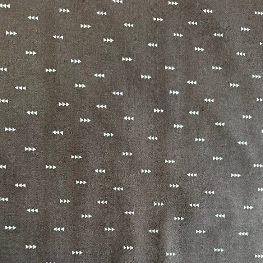 Carbon grey cotton fabric with small white triangle arrow geometric print by Eugene Textiles