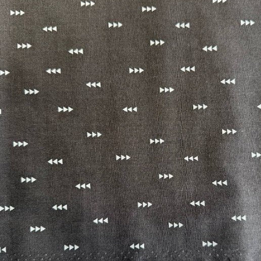 Carbon grey cotton fabric with small white triangle arrow geometric print by Eugene Textiles