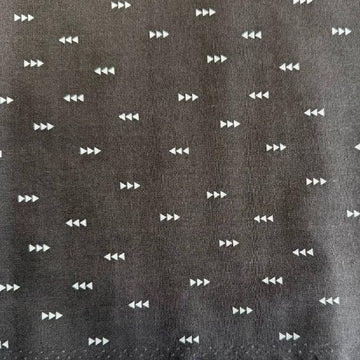 Carbon grey cotton fabric with small white triangle arrow geometric print by Eugene Textiles