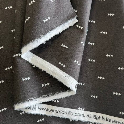 Carbon grey cotton fabric with small white triangle arrow geometric print by Eugene Textiles