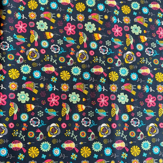 Colorful birds and flowers quilting cotton fabric on dark background from Camelot Fabrics Emma & Mila collection