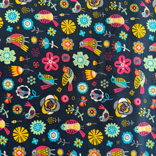 Colorful birds and flowers quilting cotton fabric on dark background from Camelot Fabrics Emma & Mila collection