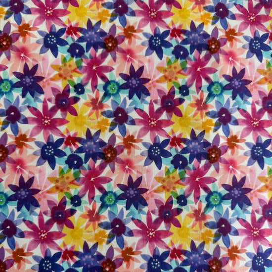 Flower Patches 1827-11 multi floral quilting cotton by Amarilys Henderson for Moda Fabrics, colorful star-shaped flowers on light pink background