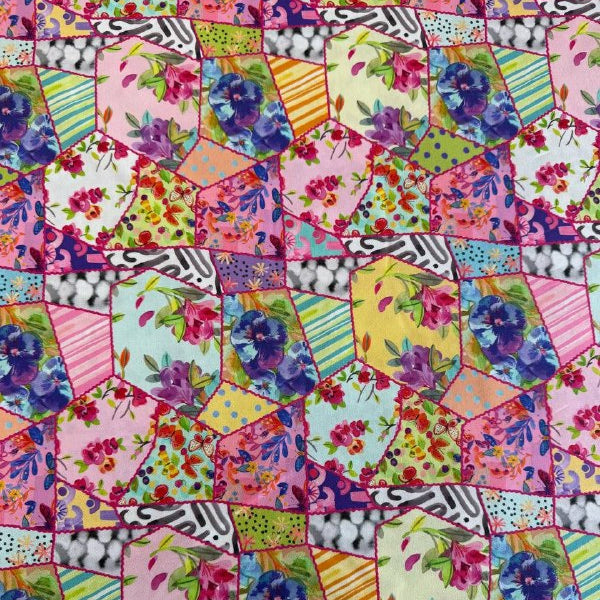 Colorful floral patchwork quilting cotton fabric with hexagon blocks, butterflies, and multicolor flowers by Amarilys Henderson for Moda Flower Patches 1824-11