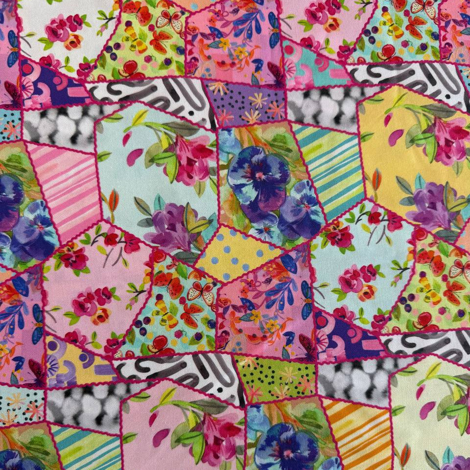 Colorful floral patchwork quilting cotton fabric with hexagon blocks, butterflies, and multicolor flowers by Amarilys Henderson for Moda Flower Patches 1824-11