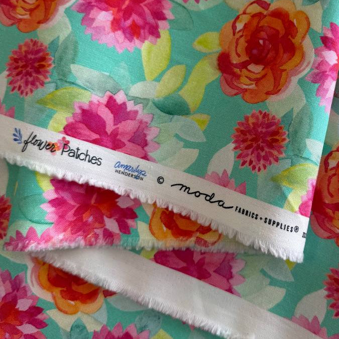 Large pink and coral floral quilting cotton fabric on aqua background by Amarilys Henderson Flower Patches Moda 1823-18