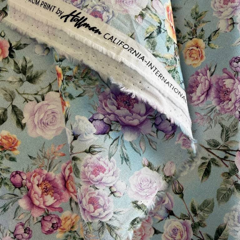 Hoffman Soiree Hyacinth pastel roses on blue background quilting cotton 25658-120