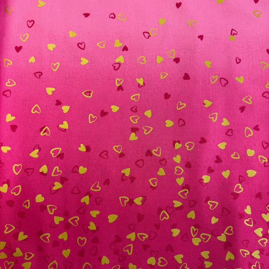 Pink ombre cotton fabric with small metallic gold and red hearts by Moda Fabric