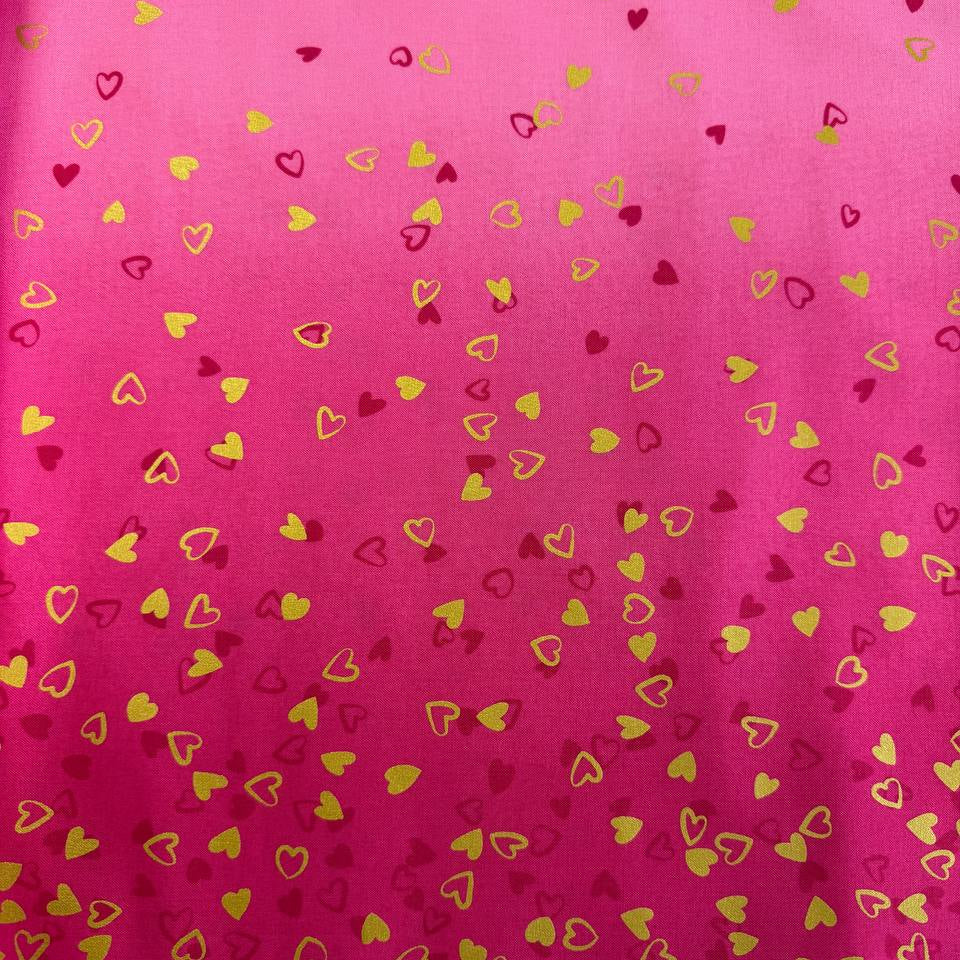 Pink ombre cotton fabric with small metallic gold and red hearts by Moda Fabric