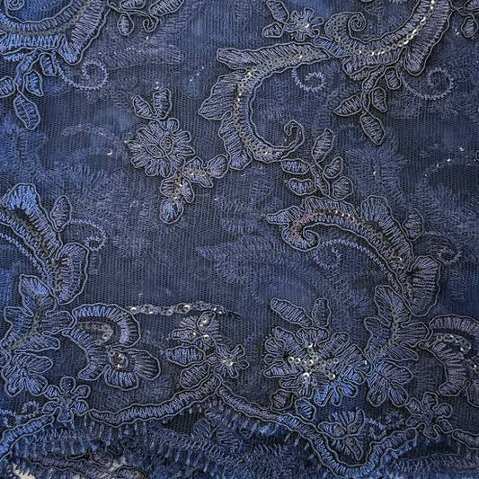 Navy embroidered floral lace fabric with shimmering sequins on a soft mesh base, perfect for formal dresses, bridal wear, and elegant sewing projects.