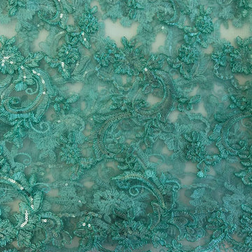 Mint green embroidered floral lace with shimmering sequins on a soft sheer mesh background, featuring elegant scalloped edges, ideal for bridal wear, evening gowns, and formal sewing projects.