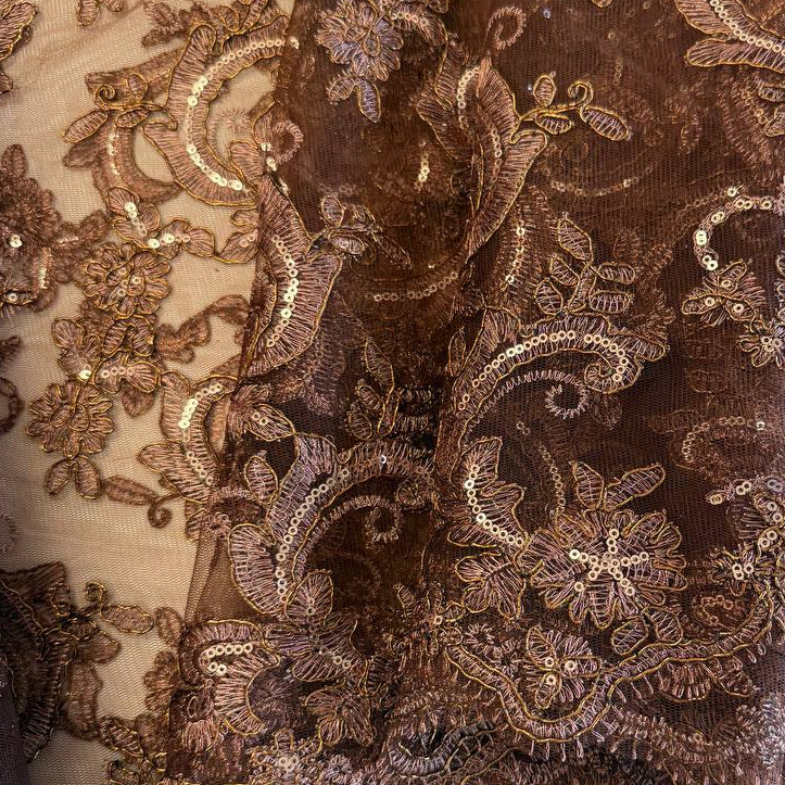 Elegant brown embroidered floral lace with shimmering sequins on a soft sheer mesh base, finished with a scalloped edge, ideal for evening gowns, formalwear, and bridal sewing projects.