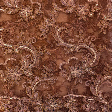 Elegant brown embroidered floral lace with shimmering sequins on a soft sheer mesh base, finished with a scalloped edge, ideal for evening gowns, formalwear, and bridal sewing projects.