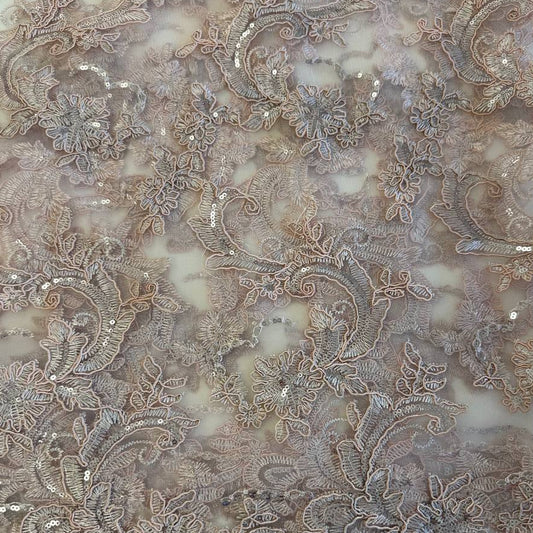 Blush pink embroidered floral lace with delicate sequins on a soft sheer mesh base, featuring an elegant scalloped edge, perfect for bridal gowns, evening dresses, and special occasion sewing projects.