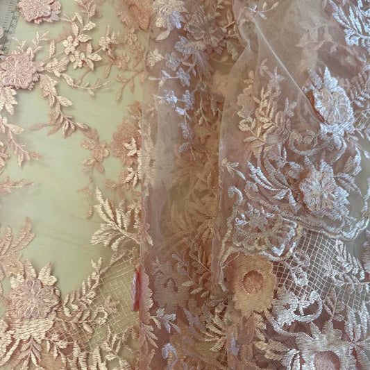 Soft blush pink 3D floral embroidered lace on a sheer mesh base with elegant scalloped edges, perfect for bridal gowns, evening dresses, veils, and luxury sewing projects.