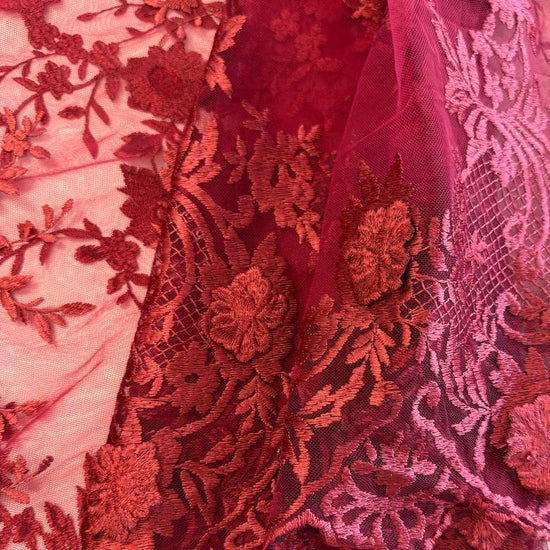 Elegant dark red (burgundy) 3D floral embroidered lace on a soft sheer mesh base with a delicate scalloped edge, ideal for evening gowns, formal dresses, bridal designs, and luxury sewing projects.