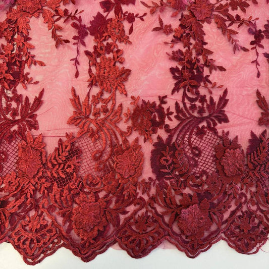 Elegant dark red (burgundy) 3D floral embroidered lace on a soft sheer mesh base with a delicate scalloped edge, ideal for evening gowns, formal dresses, bridal designs, and luxury sewing projects.