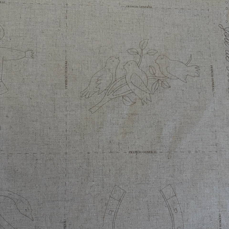 Joie De Vivre French General cotton fabric panel with vintage embroidery style illustrations on natural linen look background