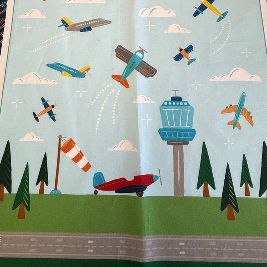 Aviation Adventures airplane cotton fabric panel by Michael Miller with colorful planes sky clouds airport tower blue background