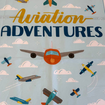 Aviation Adventures airplane cotton fabric panel by Michael Miller with colorful planes sky clouds airport tower blue background