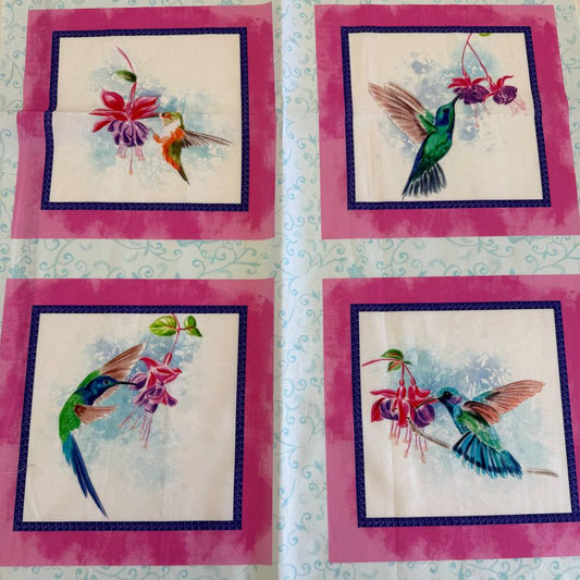 Painted Garden hummingbird cotton fabric panel with pink framed squares and colorful birds with fuchsia flowers on light blue background